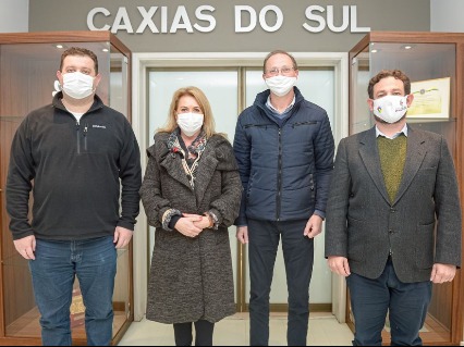 Four stands behind the door with sign, Caxiaus do Sul, on the top of door